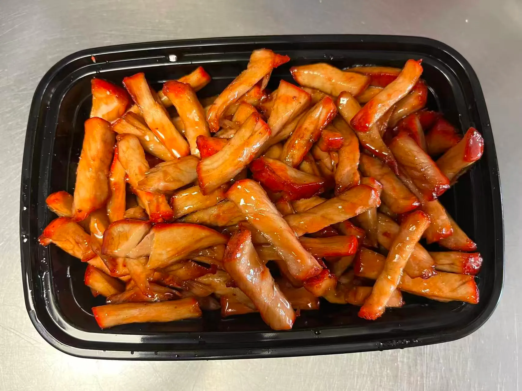 Savory, marinated pork strips glazed in BBQ sauce at Orient Chef, a Asian Restaurant in Davie