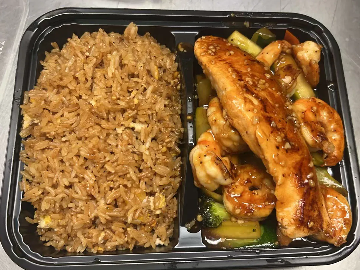 Juicy steGrilled chicken & shrimp with savory fried rice at Orient Chef, a Asian Restaurant in Davieak bites & veggies with fried rice at Orient Chef, a Asian Restaurant in Davie